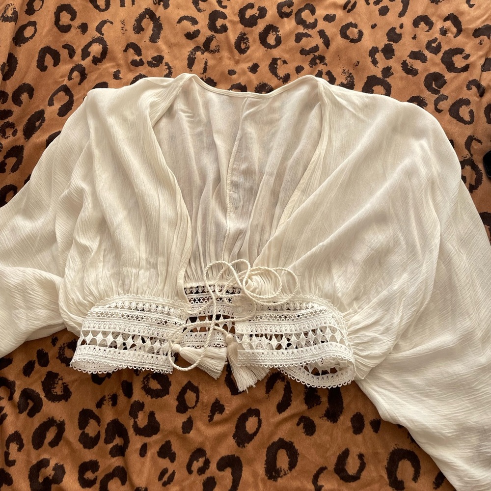 White mid sleeve top with tie front and flowy sleeves